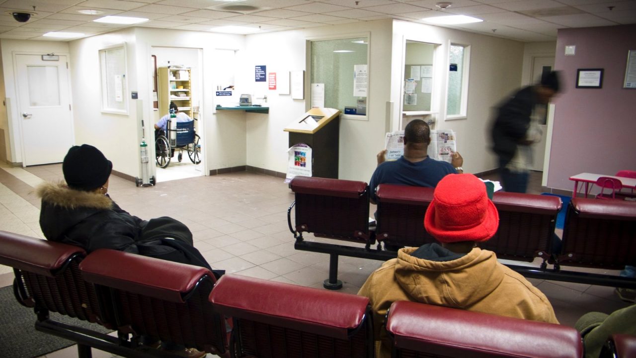 People sitting in a hospital waiting room.